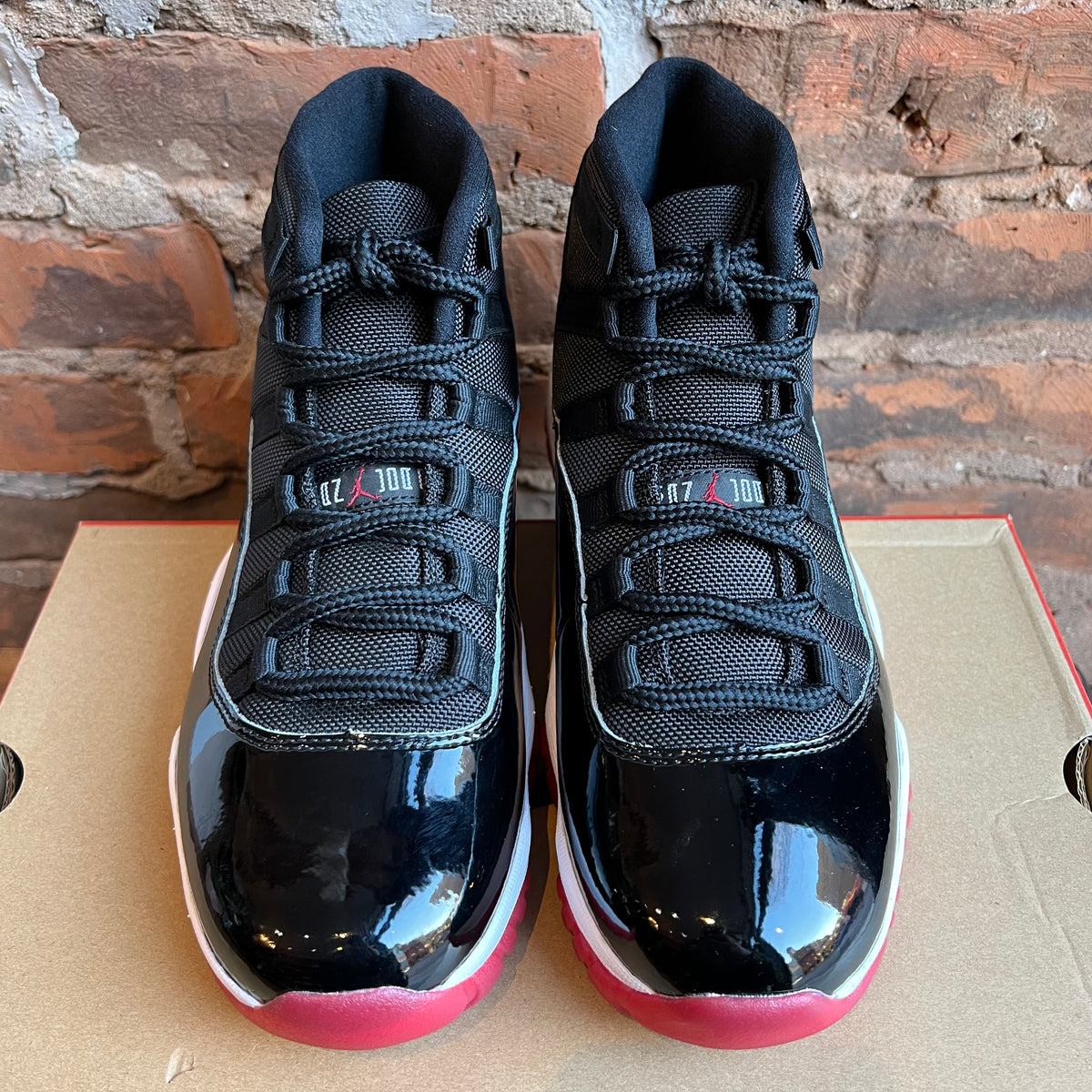 Jordan 11 bred on sale price